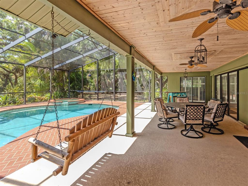 2602 Firetree Lane Venice, FL 34292 - Photo 25 of 31 a view of a chairs and table in the patio