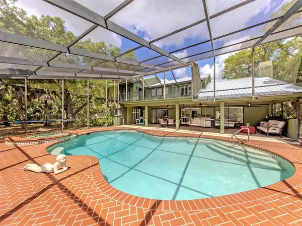 a view of a swimming pool with a patio