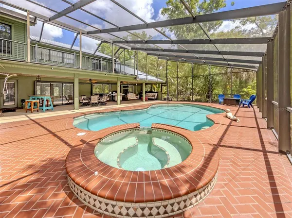 a view of a swimming pool with a patio