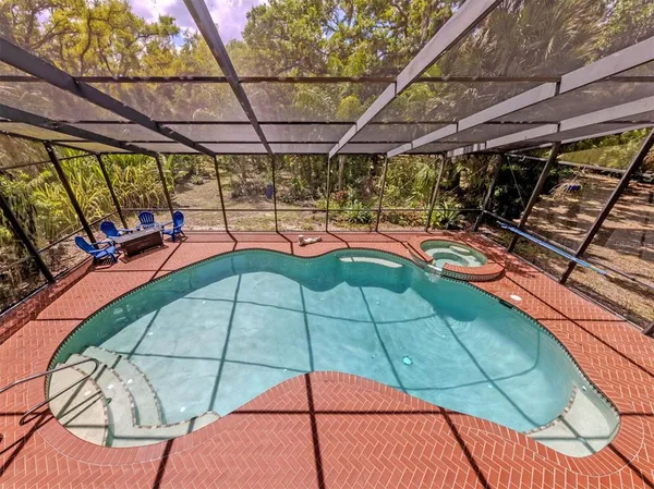 a view of a swimming pool with a patio