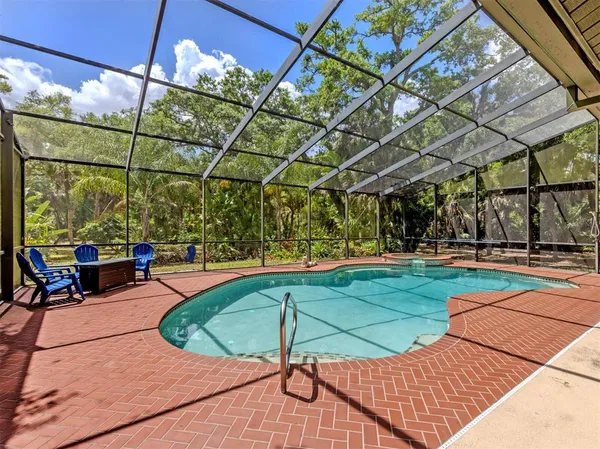 a view of a swimming pool with a patio