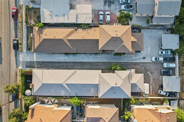 an aerial view of a house with a swimming pool