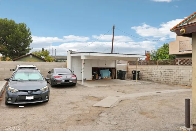a view of parking area with parked cars