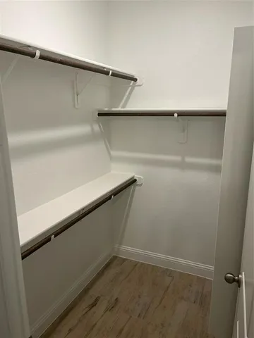 a view of an empty walk in closet