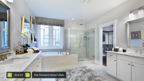 a spacious bathroom with sink shower and mirror