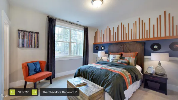 a bedroom with bed and a couch