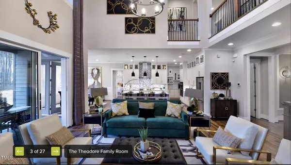 a living room with furniture and a chandelier