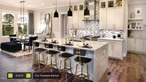 a kitchen with a sink appliances and cabinets