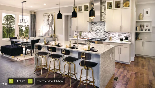 a kitchen with a sink appliances and cabinets