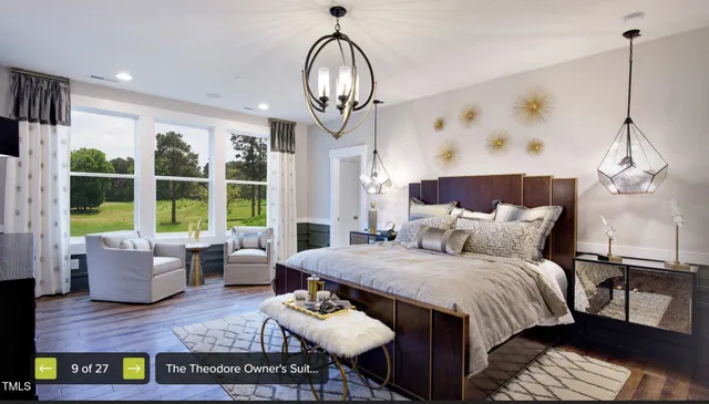 a bedroom with bed and wooden floor