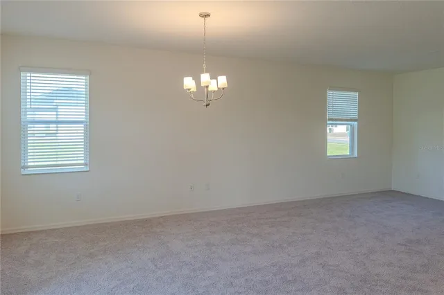 a view of a kitchen with a sink and a refrigerator