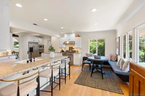 a view of a dining room with furniture window and outside view