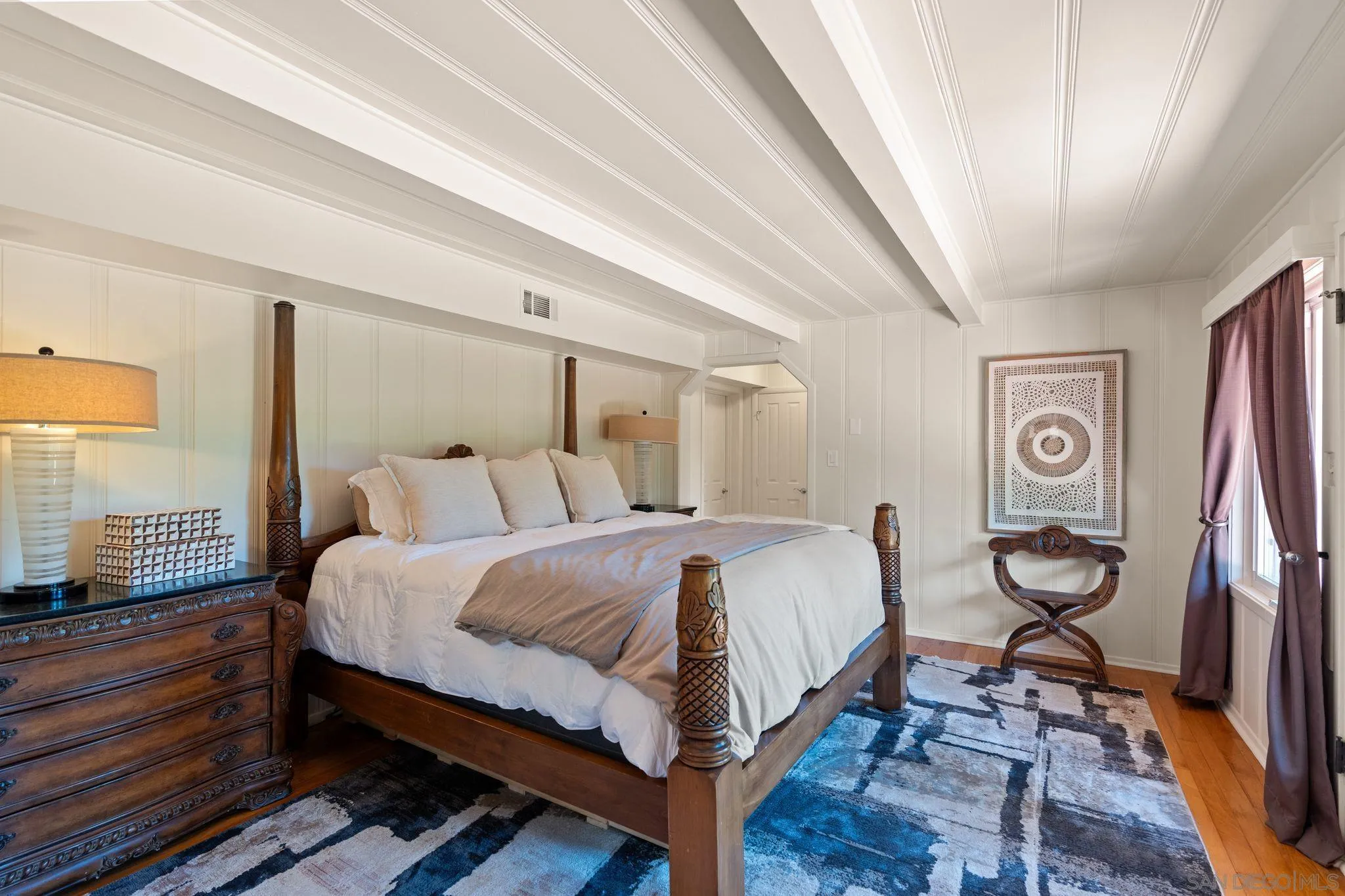 6347 Las Colinas Rancho Santa Fe, CA 92067 - Photo 19 of 24 a bed room with a bed and a chandelier