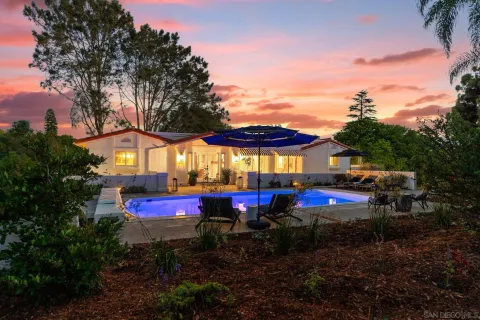 a view of swimming pool with sitting area