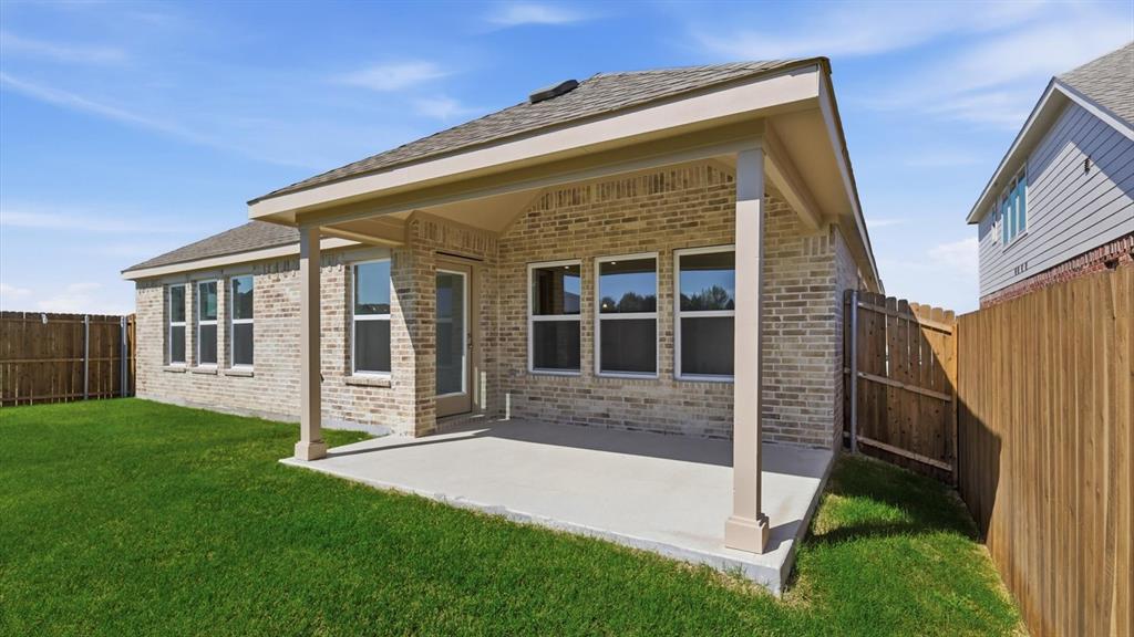 2529 Rivers W Road Anna, TX 75409 - Photo 40 of 40 Rear exterior with a covered concrete patio, brick facade, and multiple windows