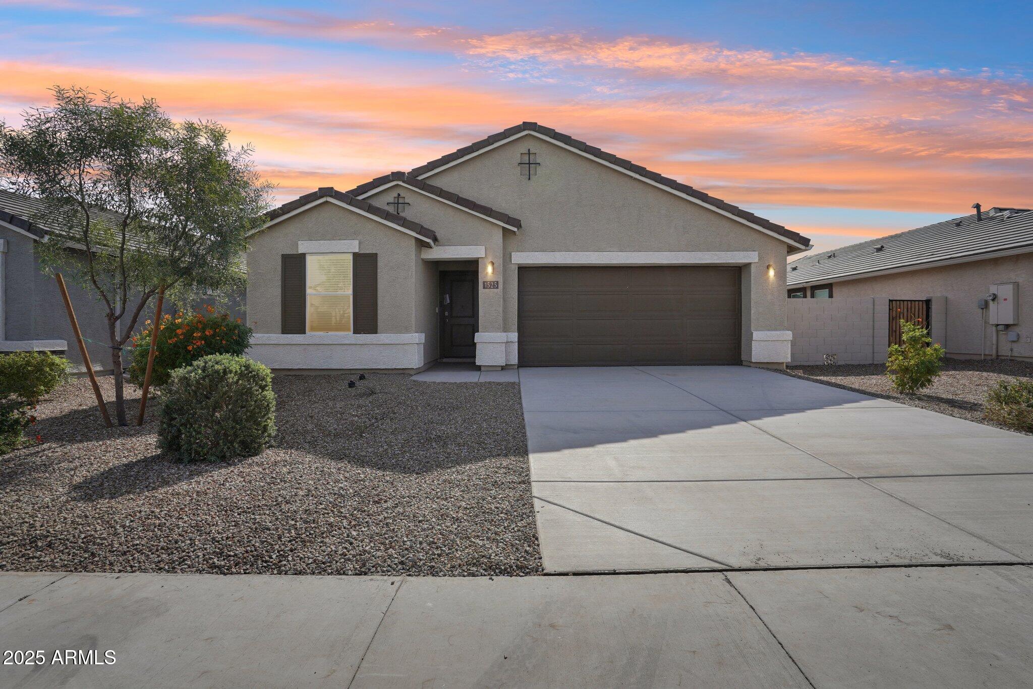 1566 East Yeoman Drive Casa Grande, AZ 85122 - Photo 1 of 28 front view of a house with potted plants