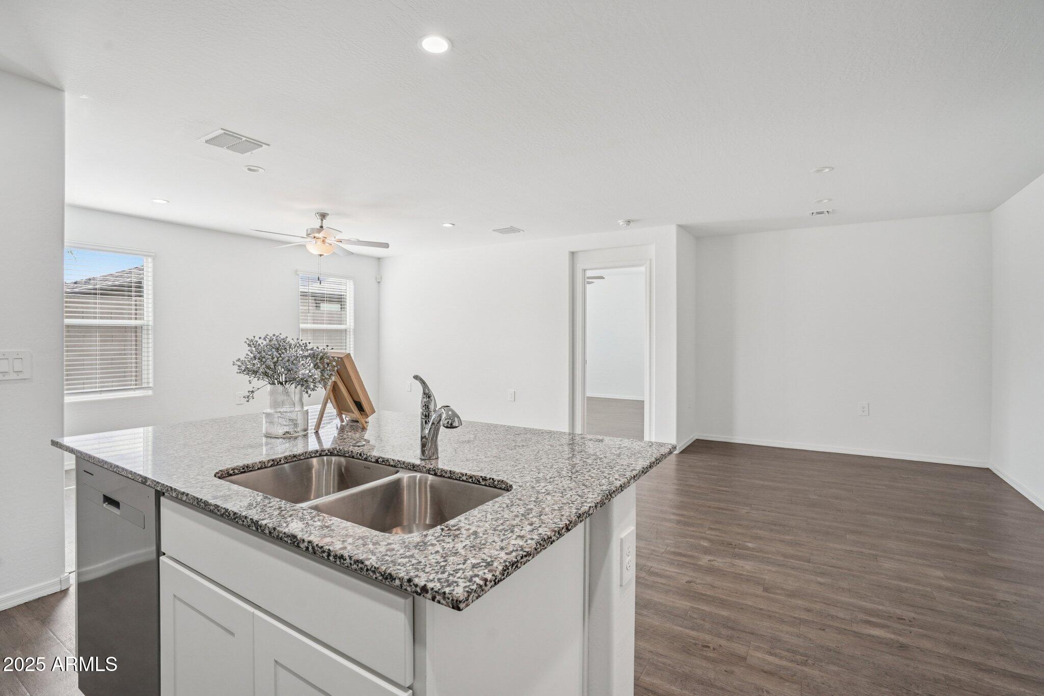 1566 East Yeoman Drive Casa Grande, AZ 85122 - Photo 14 of 28 a kitchen with a sink and cabinets