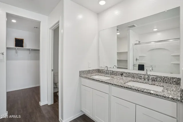 a bathroom with a glass shower door