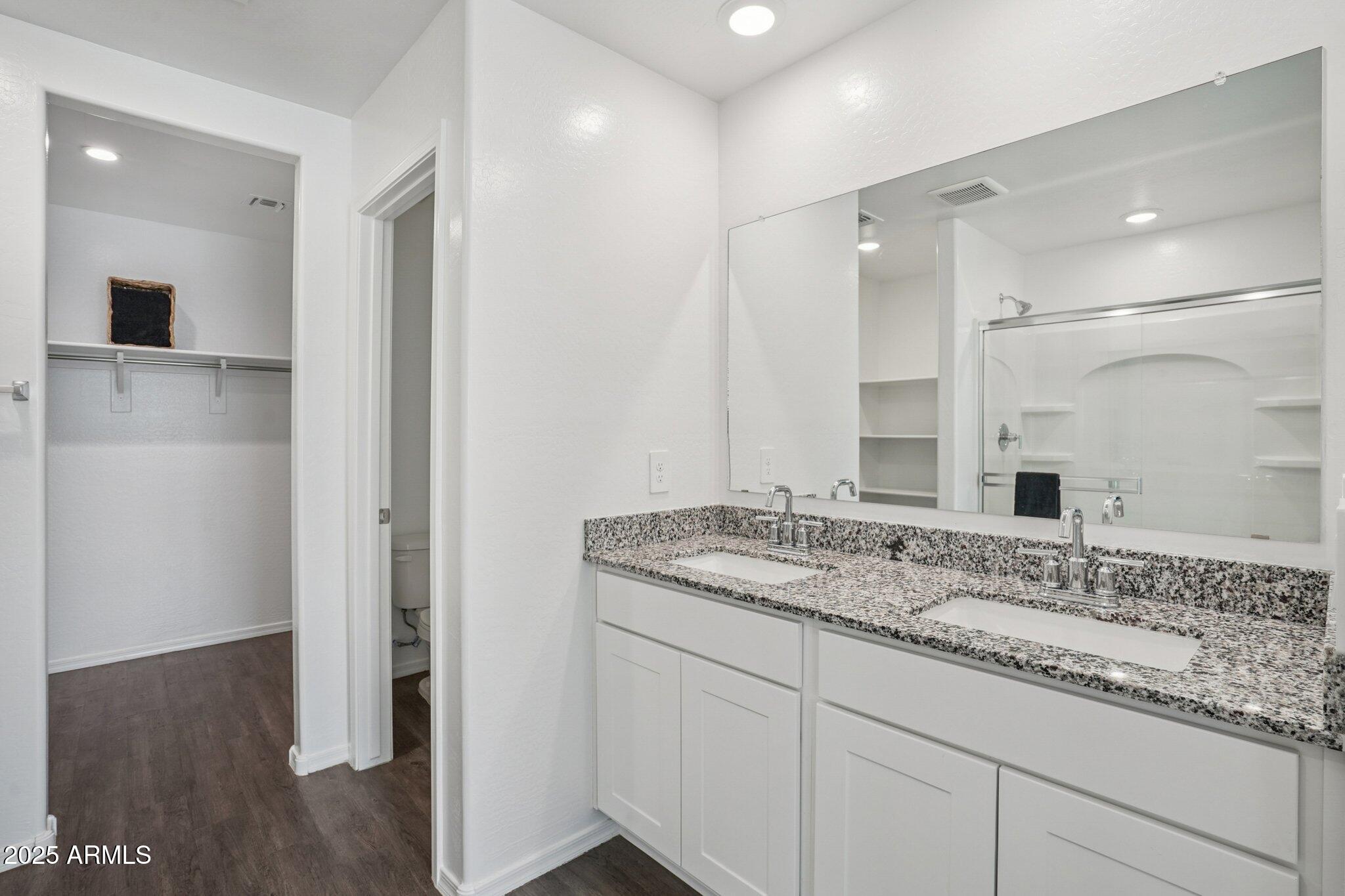 1566 East Yeoman Drive Casa Grande, AZ 85122 - Photo 20 of 28 a bathroom with a granite countertop sink and a mirror