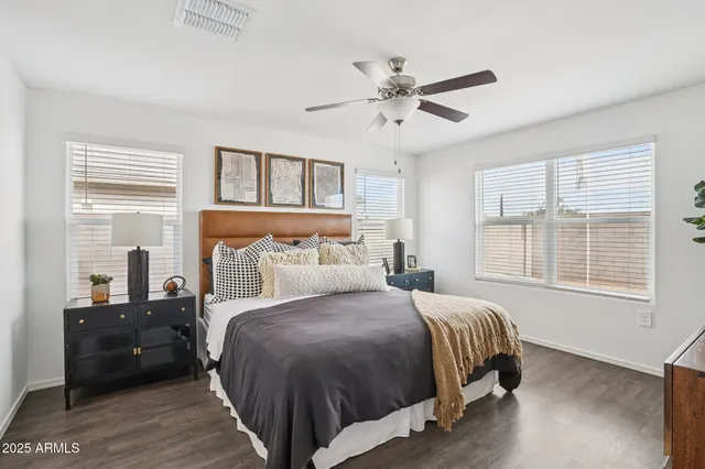 a bedroom with a large bed and a window