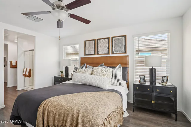 a bedroom with a large bed and a large window