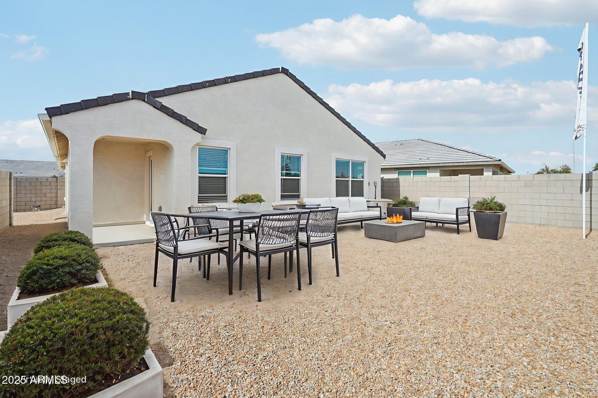 1566 East Yeoman Drive Casa Grande, AZ 85122 - Photo 8 of 28 a view of a house with patio and a garden