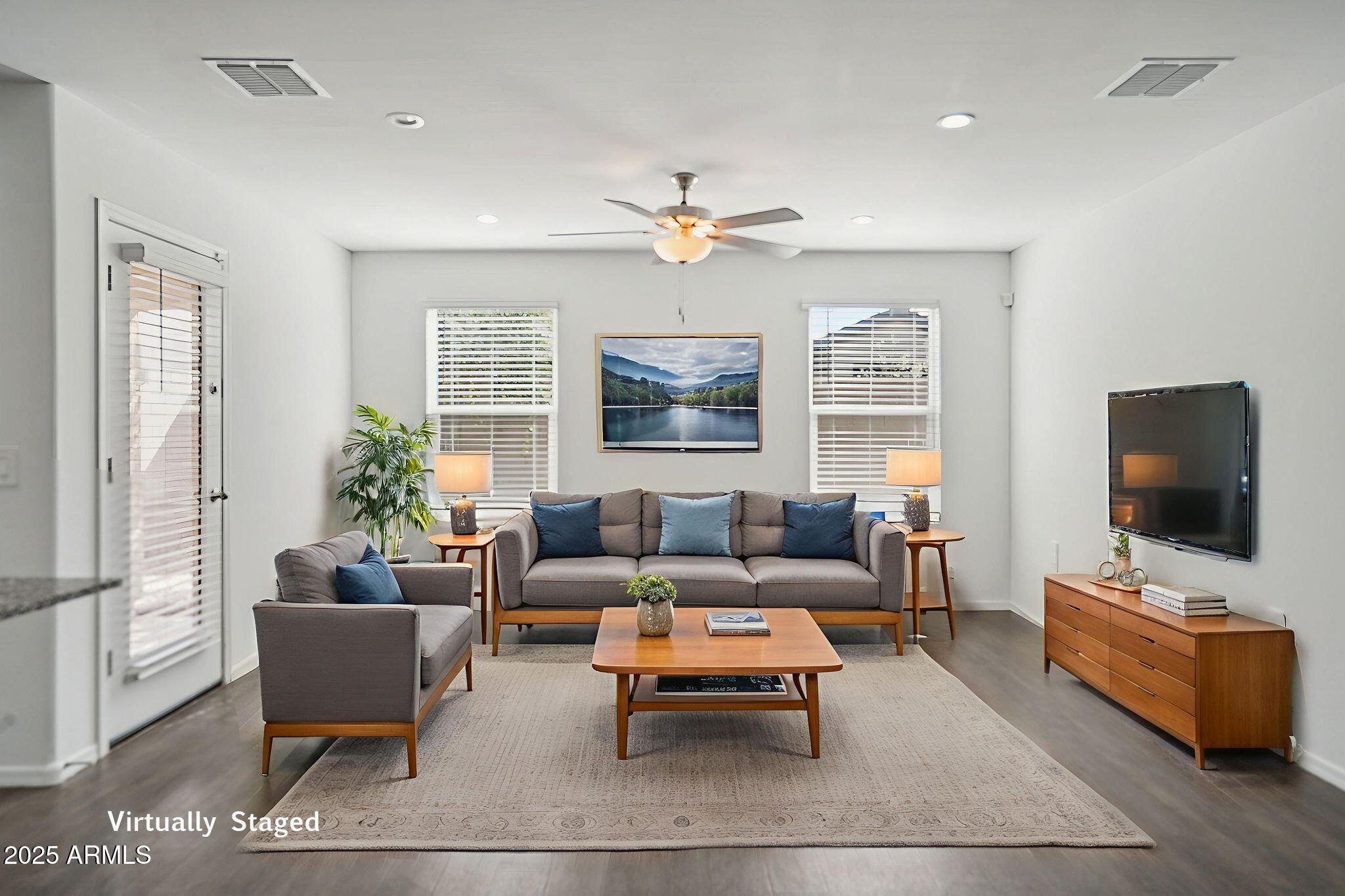 1566 East Yeoman Drive Casa Grande, AZ 85122 - Photo 9 of 28 a living room with furniture a flat screen tv and a window