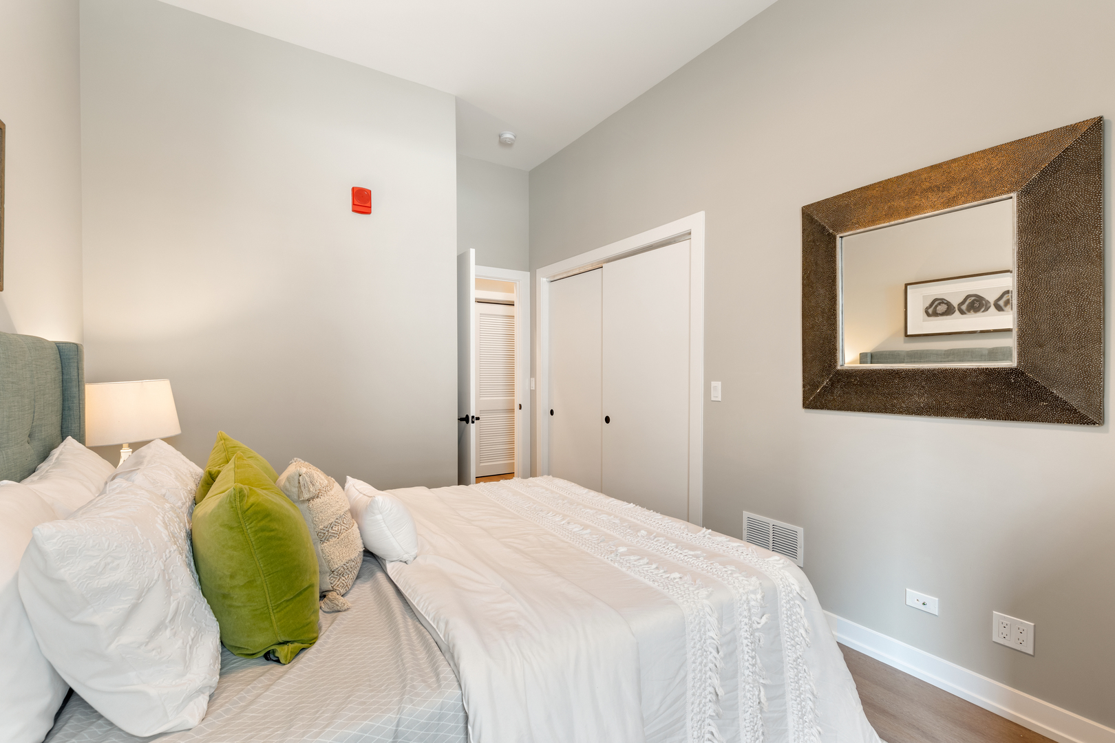 3217 North Clark Street, Unit 504 Chicago, IL 60657 - Photo 14 of 28 a bedroom with a bed and a painting on the wall