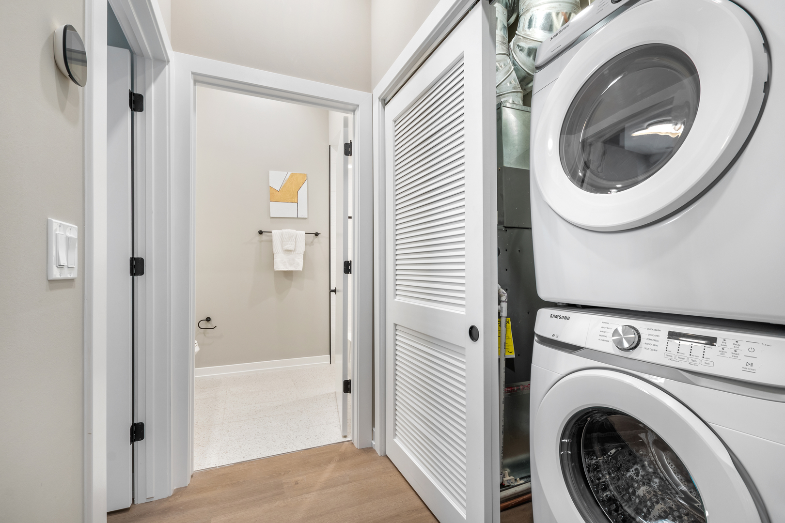 3217 North Clark Street, Unit 504 Chicago, IL 60657 - Photo 18 of 28 a view of a hallway with washer and dryer