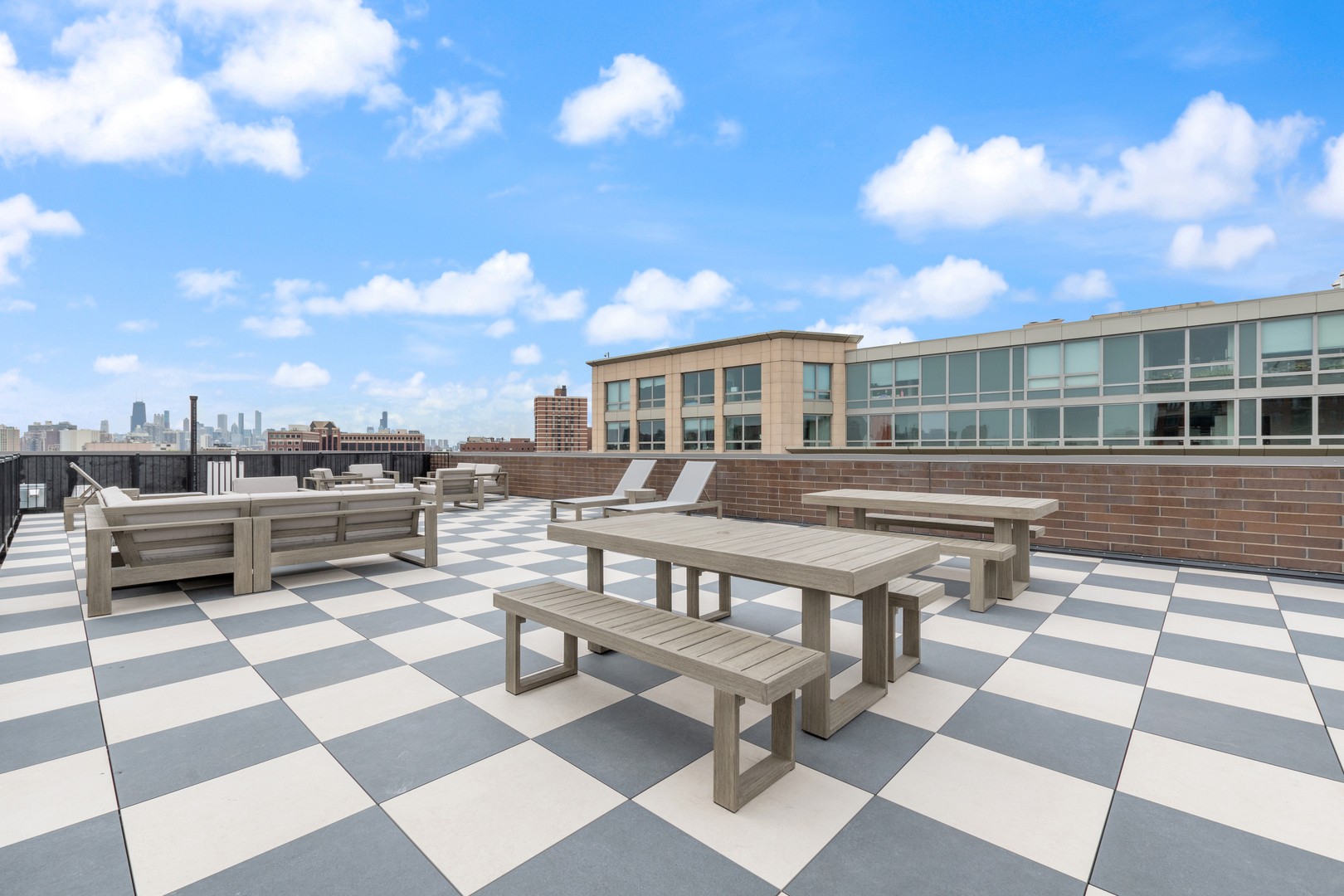 3217 North Clark Street, Unit 504 Chicago, IL 60657 - Photo 19 of 28 a view of a patio with a dining table and chairs with wooden floor