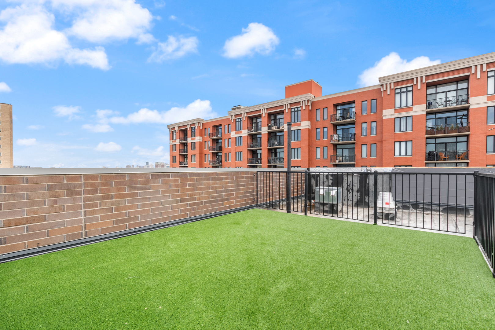 3217 North Clark Street, Unit 504 Chicago, IL 60657 - Photo 26 of 28 a view of an apartment with a garden