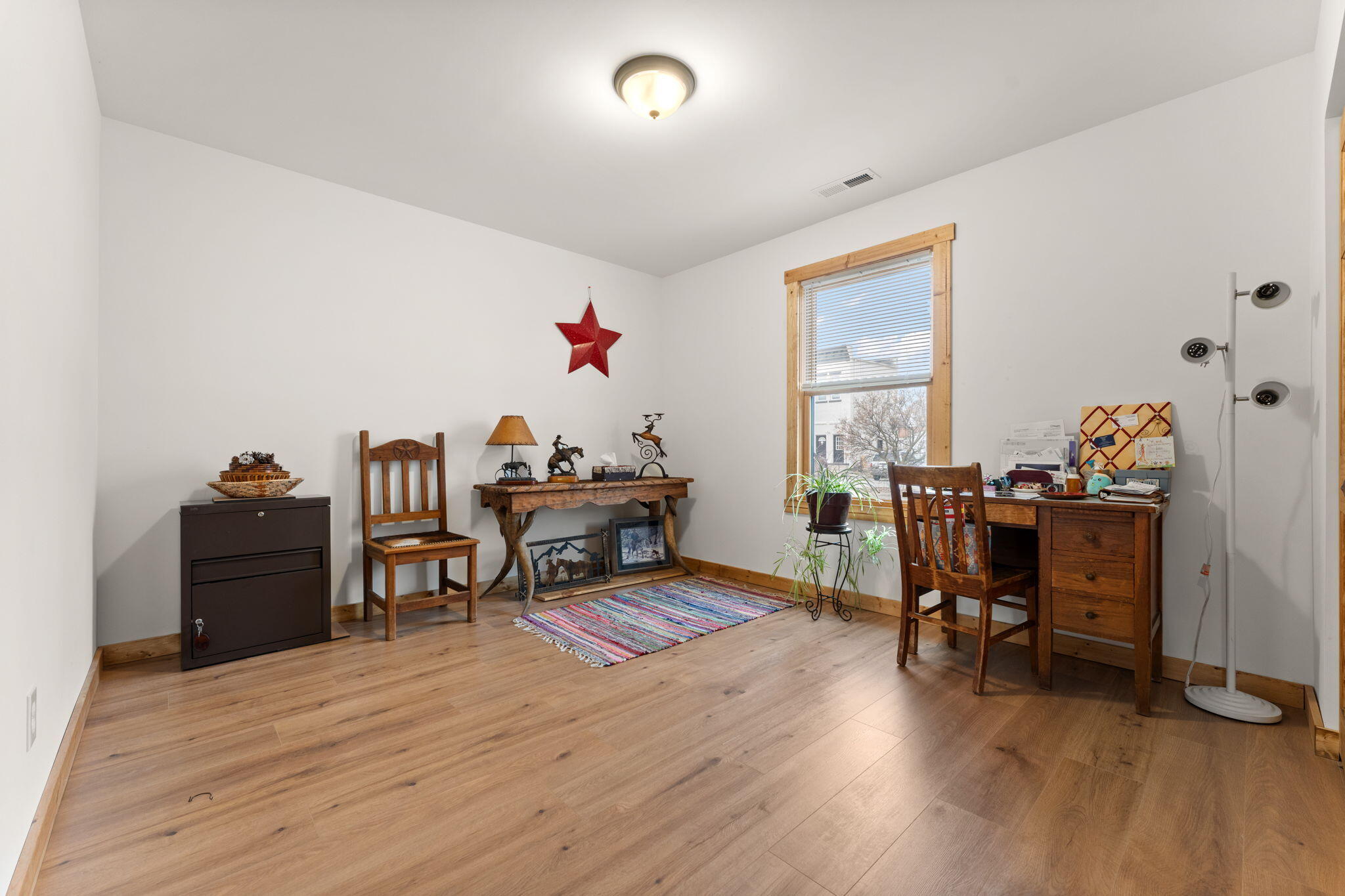 25 East Grove Street Wheatfield, IN 46392 - Photo 11 of 21 a living room with furniture and a wooden floor