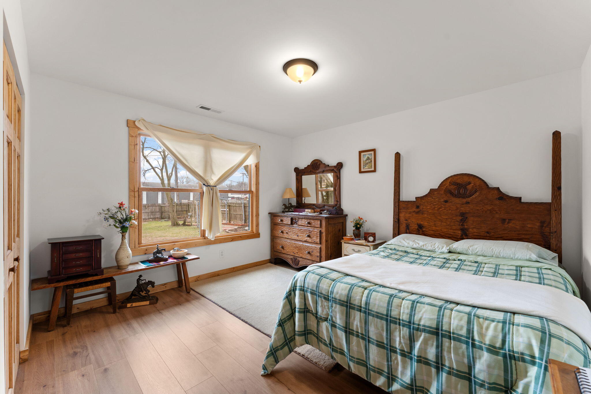 25 East Grove Street Wheatfield, IN 46392 - Photo 13 of 21 a bedroom with a bed a couch and a window