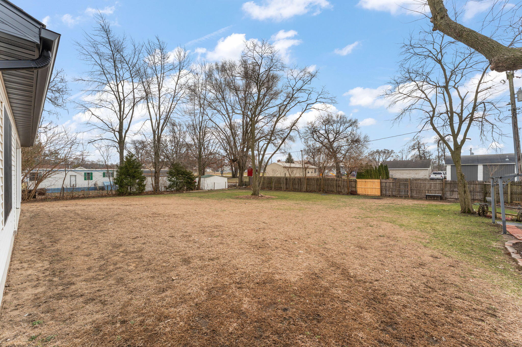 25 East Grove Street Wheatfield, IN 46392 - Photo 17 of 21 a backyard of a house with lots of green space