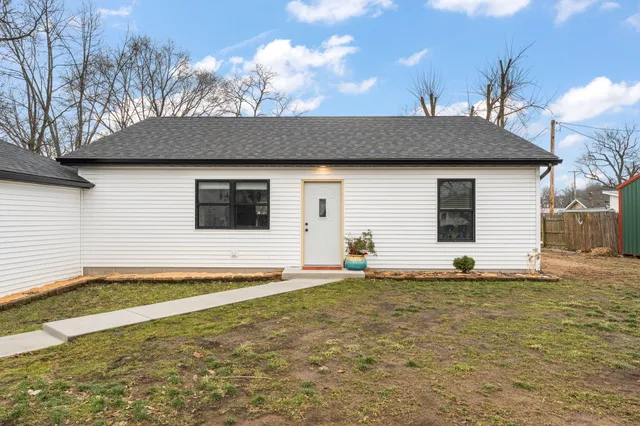 a house view with a backyard space