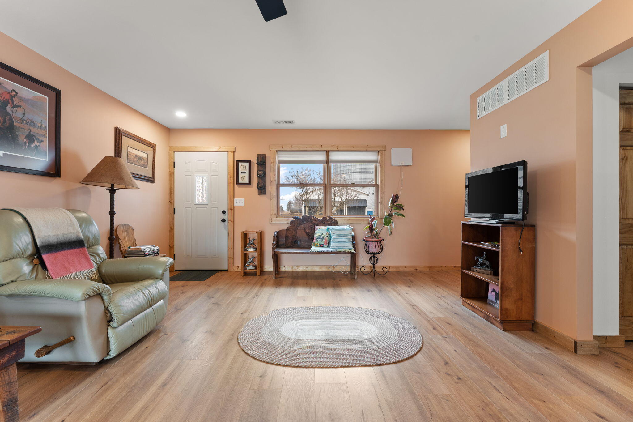 25 East Grove Street Wheatfield, IN 46392 - Photo 5 of 21 a living room with furniture and a flat screen tv