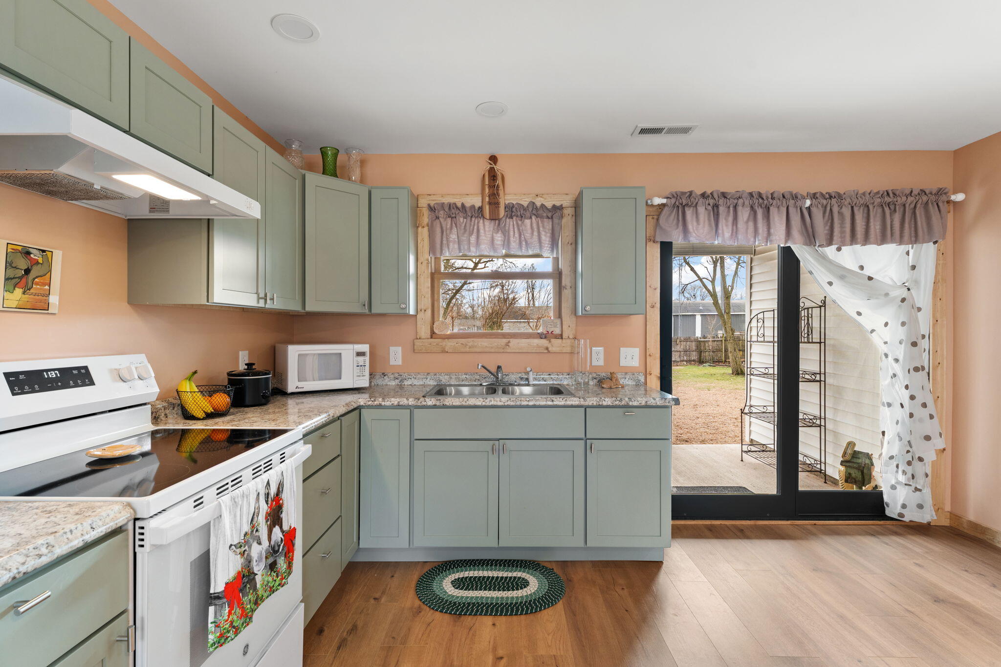 25 East Grove Street Wheatfield, IN 46392 - Photo 8 of 21 a kitchen with stainless steel appliances granite countertop a stove and a sink