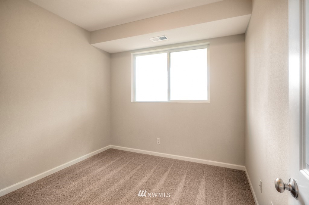 21118 Meridian Drive Southeast, Unit P4 Bothell, WA 98021 - Photo 15 of 29 an empty room with a window