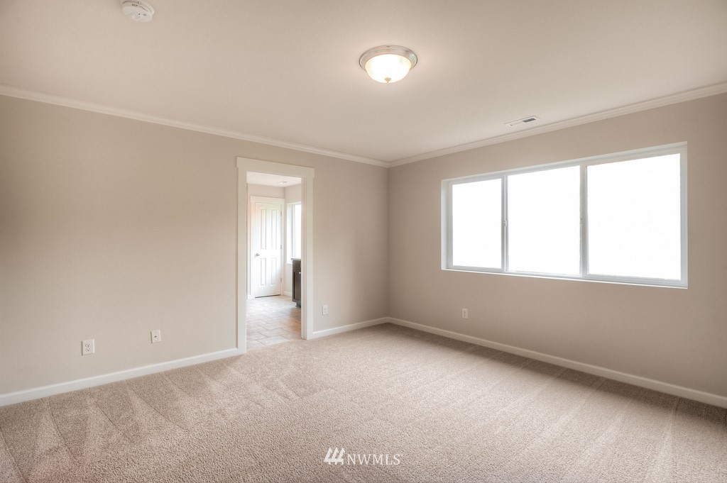 21118 Meridian Drive Southeast, Unit P4 Bothell, WA 98021 - Photo 20 of 29 an empty room with a window