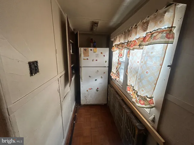 a view of a hallway with washer and dryer