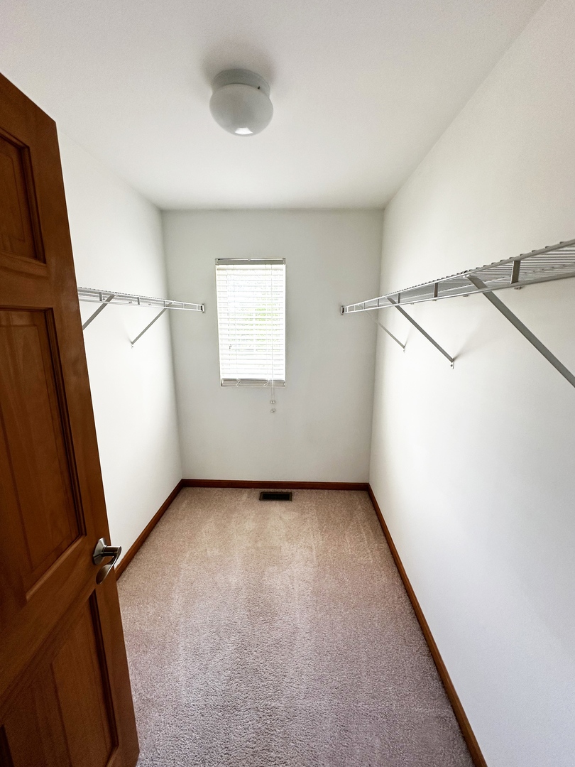 24252 Leski Lane Plainfield, IL 60585 - Photo 6 of 11 a view of a room with window and a white wall