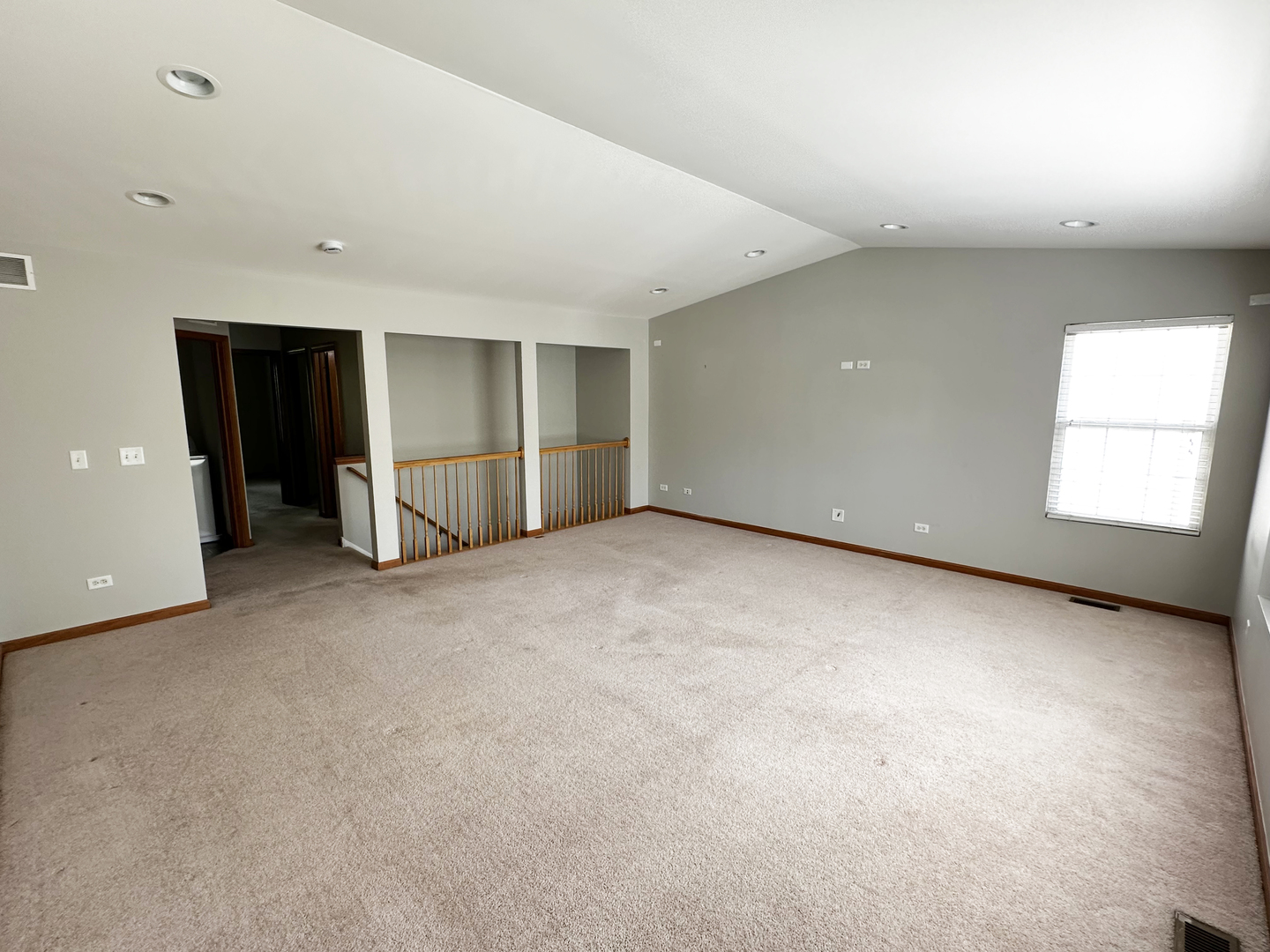 24252 Leski Lane Plainfield, IL 60585 - Photo 7 of 11 an empty room with a window and a refrigerator
