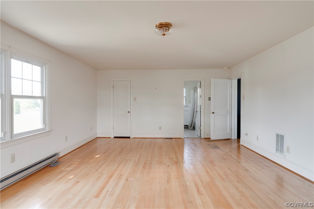 1700 Midview Road Henrico, VA 23231 - Photo 24 of 50 an empty room with wooden floor and windows