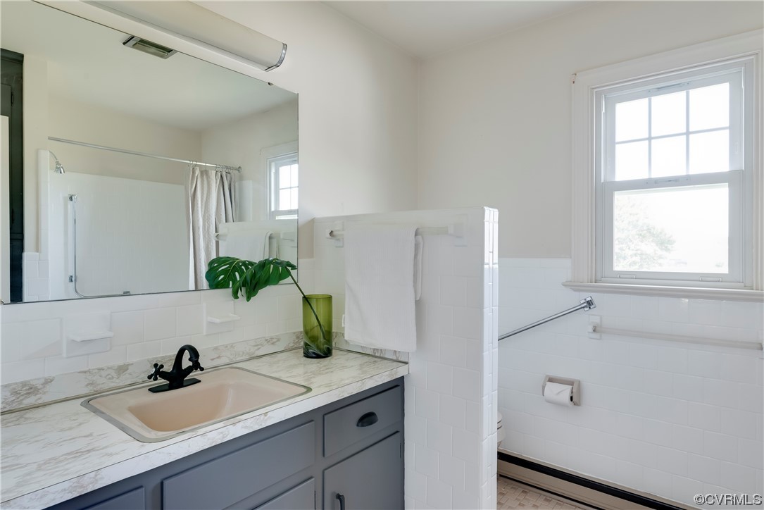 1700 Midview Road Henrico, VA 23231 - Photo 25 of 50 a bathroom with a sink and a mirror
