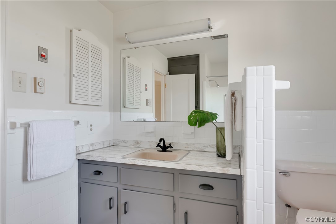 1700 Midview Road Henrico, VA 23231 - Photo 27 of 50 a bathroom with a sink vanity and mirror