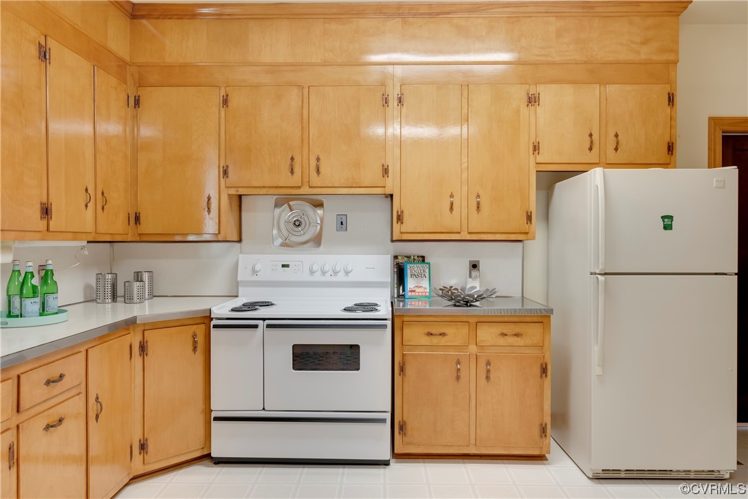 1700 Midview Road Henrico, VA 23231 - Photo 32 of 50 a kitchen with granite countertop cabinets and white appliances