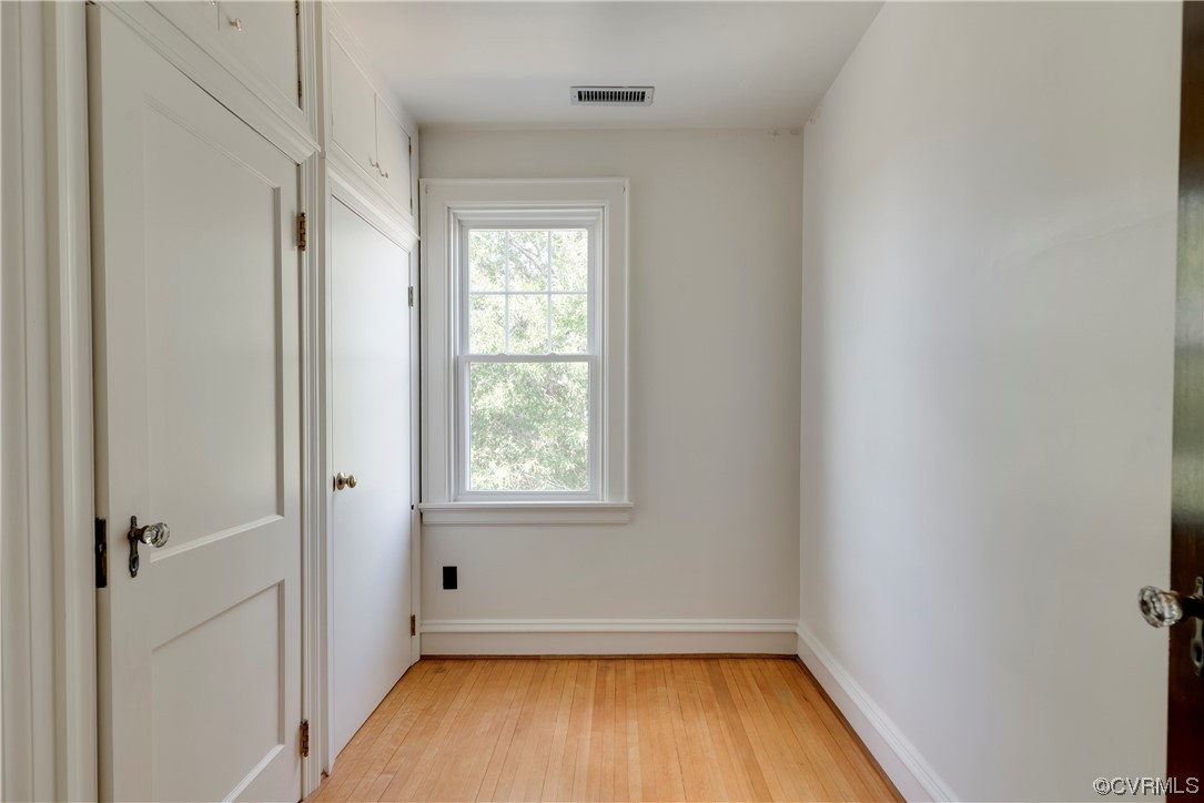 1700 Midview Road Henrico, VA 23231 - Photo 39 of 50 an empty room with a window and wooden floor