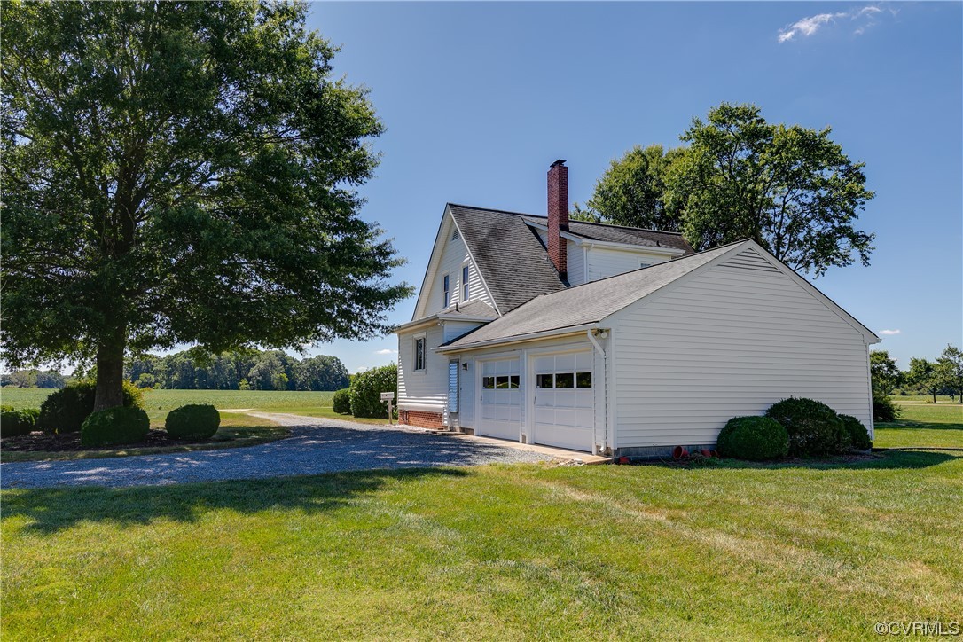 1700 Midview Road Henrico, VA 23231 - Photo 4 of 50 a view of a white house with a swimming pool and a yard