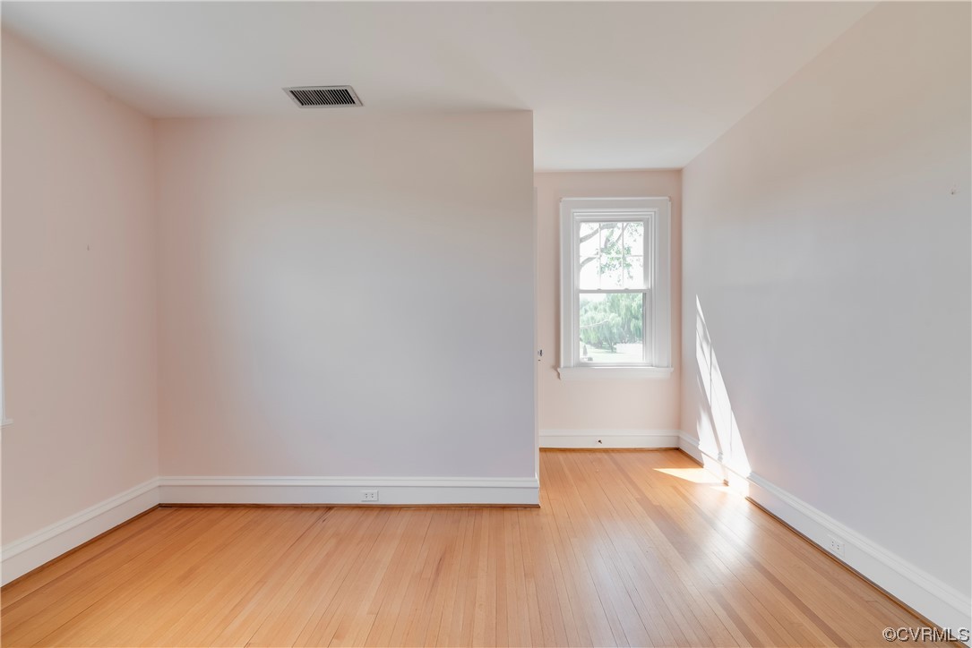1700 Midview Road Henrico, VA 23231 - Photo 45 of 50 a view of an empty room with wooden floor and a window