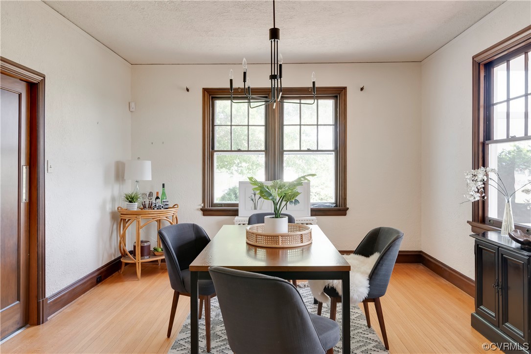 1700 Midview Road Henrico, VA 23231 - Photo 10 of 50 a dining room with furniture a potted plant and wooden floor